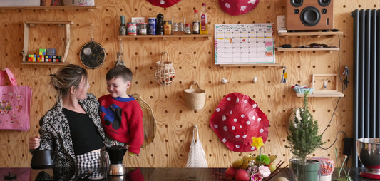creative family uses monthly planner on wall